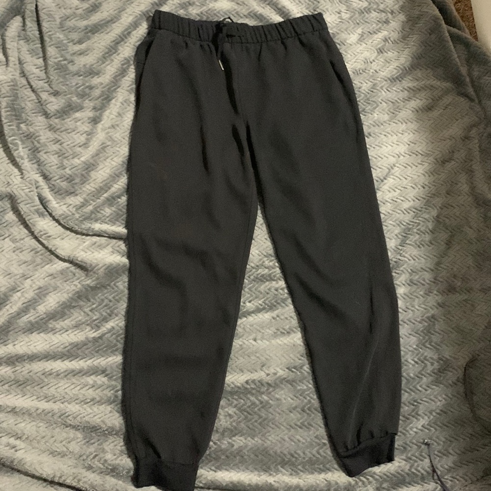 Black athletic joggers tie waist with cinched ankle with pocket